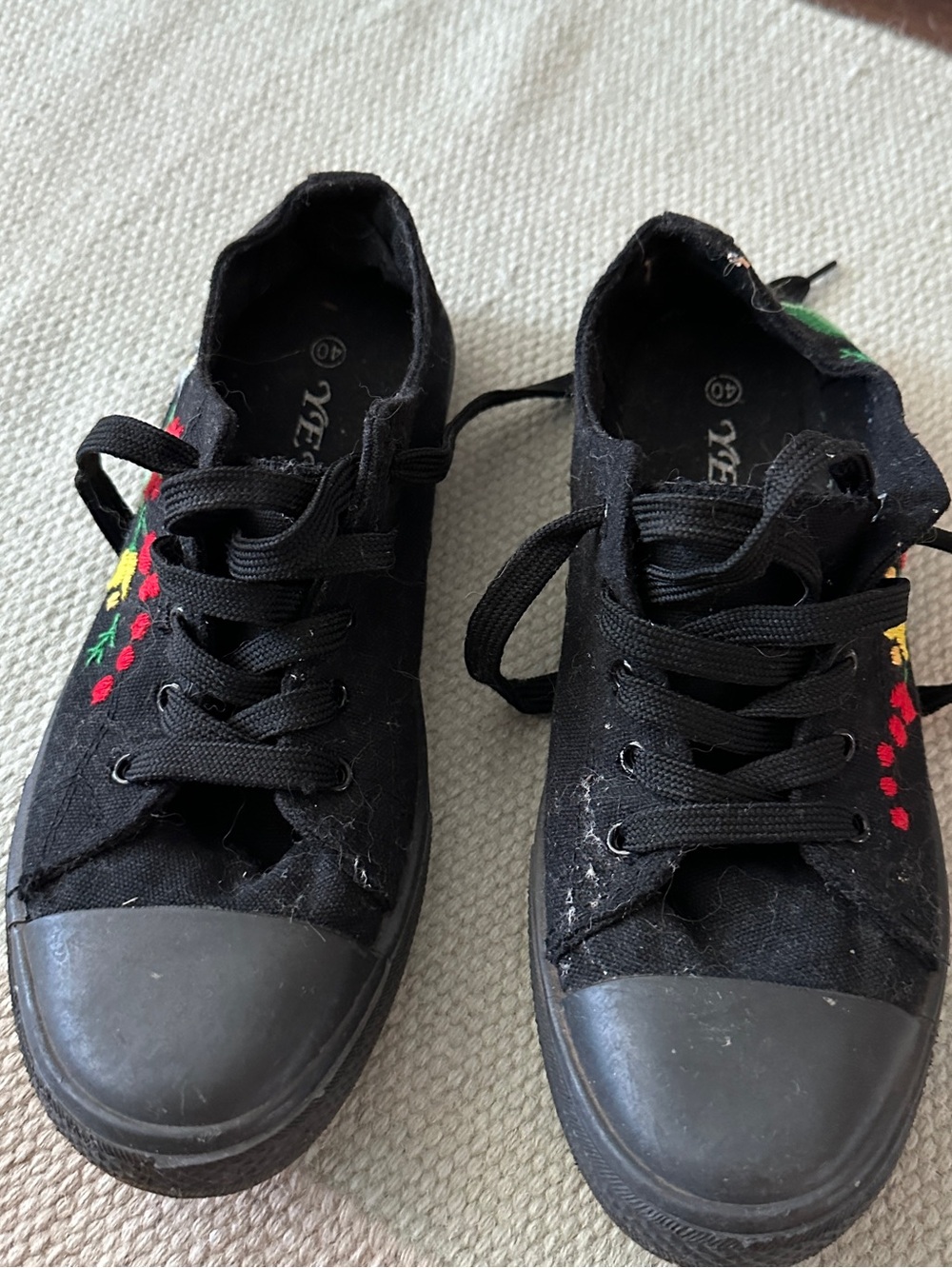 Black sneakers with floral embroidery